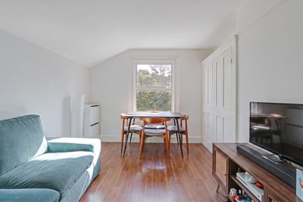 Photo decluttering software after — the same attic living room cleared of clutter by PhotoClear